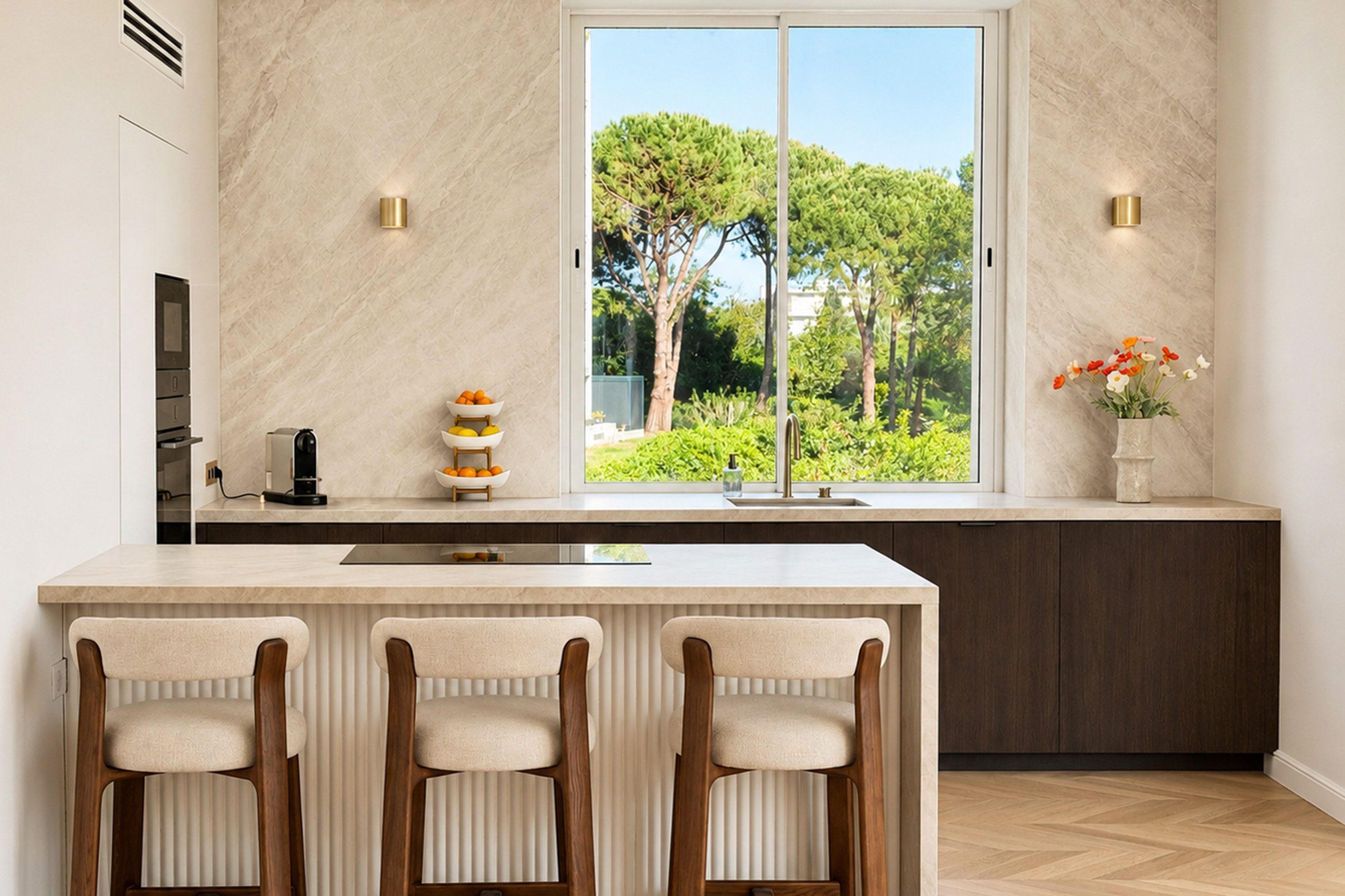 Kitchen island with oak cabinetry and garden view through the window